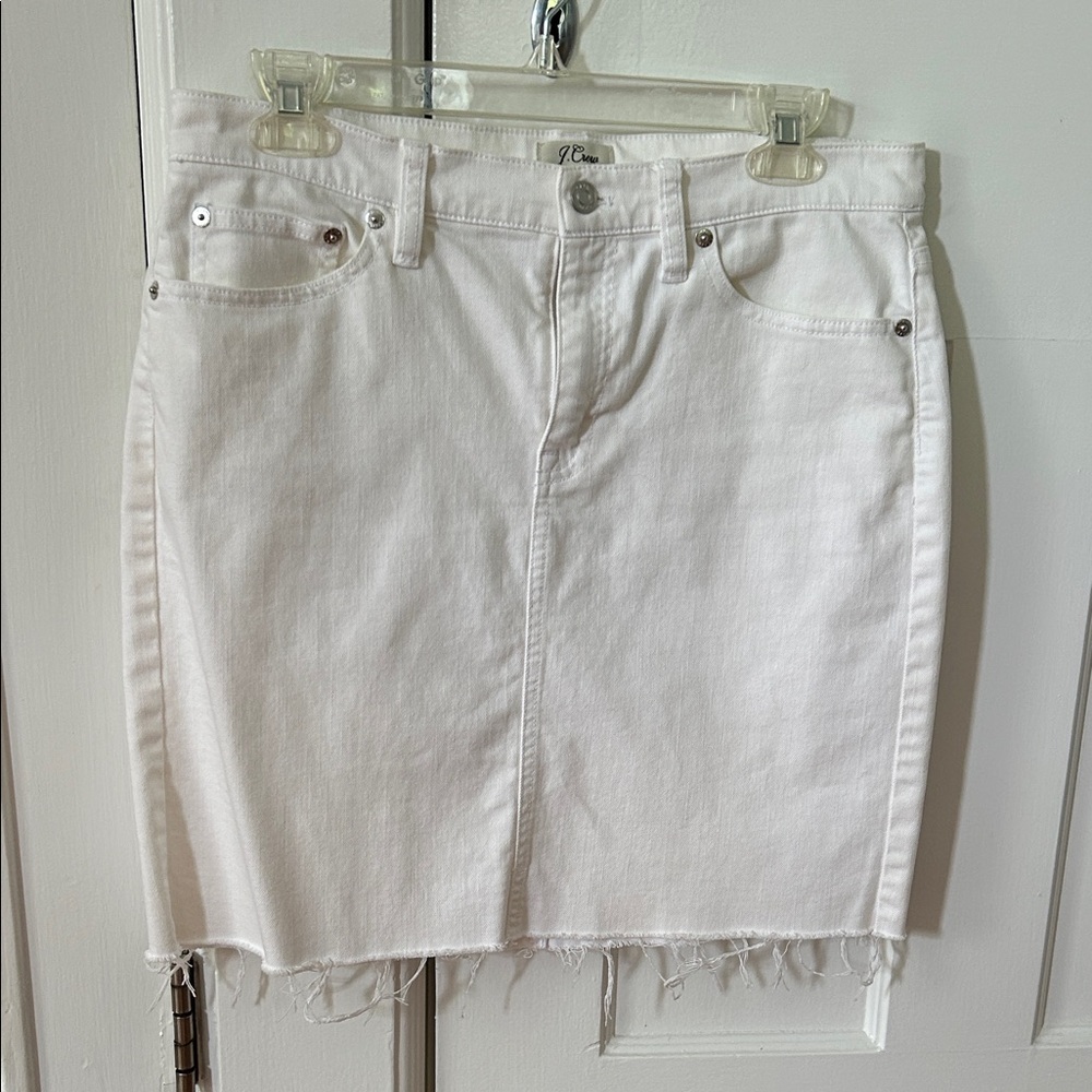 J Crew white denim mini skirt with frayed hem.